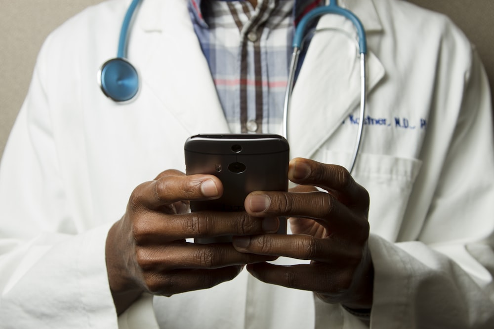 Doctor using a digital tablet in a clinic